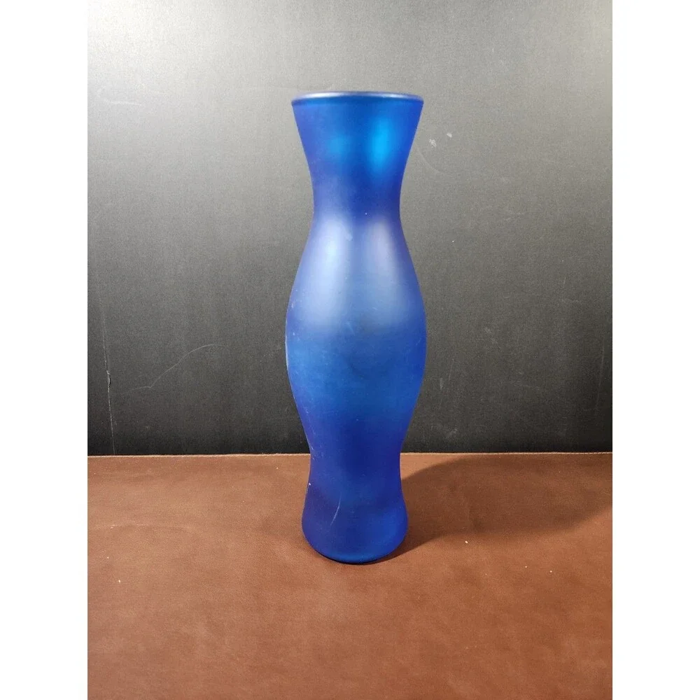 IKEA Salong blue glass vase, designed by Johanna Jelinek, features a...